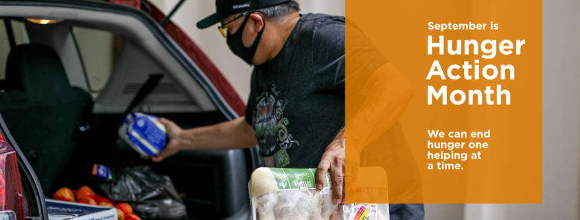 Food Bank client loads food into his car during COVID-19.