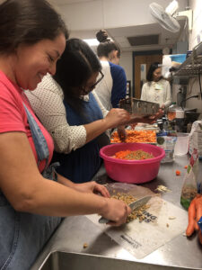 Participants participate in cooking class and nutrition training at a Cooking Matters class