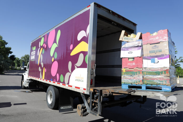 Staff Load Trucks Headed for Local Food Banks